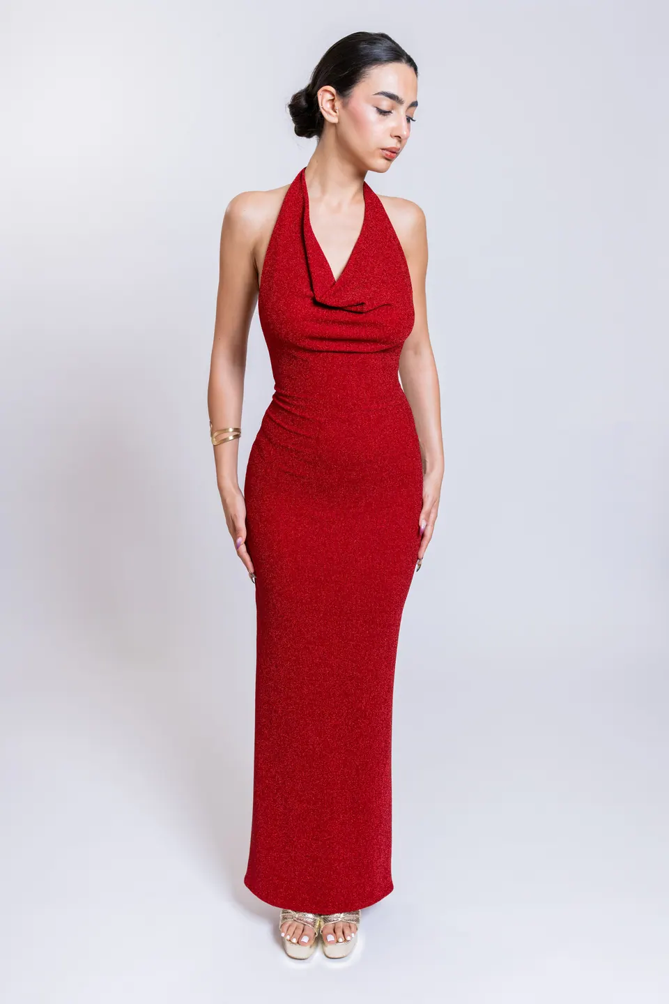 Model wearing the GALIA red draped cowl halter neck maxi dress, front view