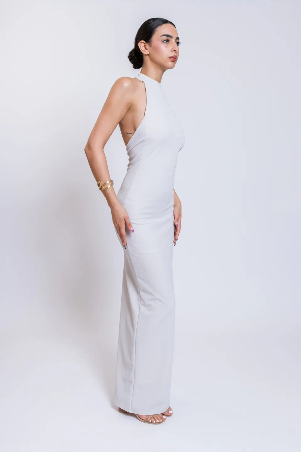 CÉLINE white high halter maxi dress in three-quarter side view