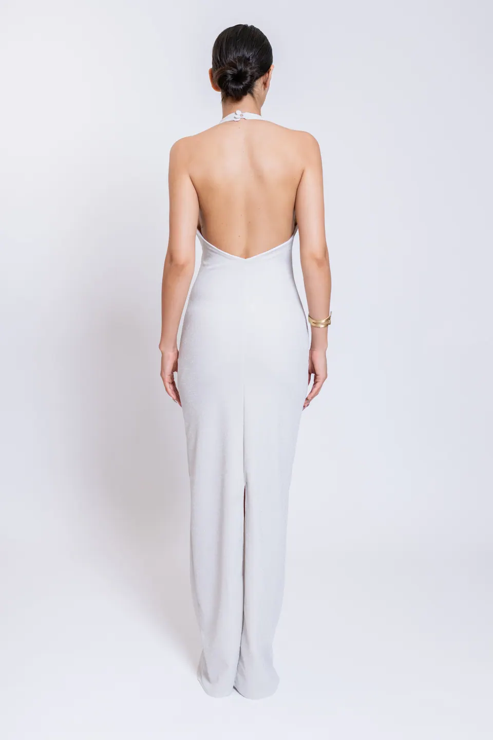 Back view of the CÉLINE white maxi dress with open back and rear slit