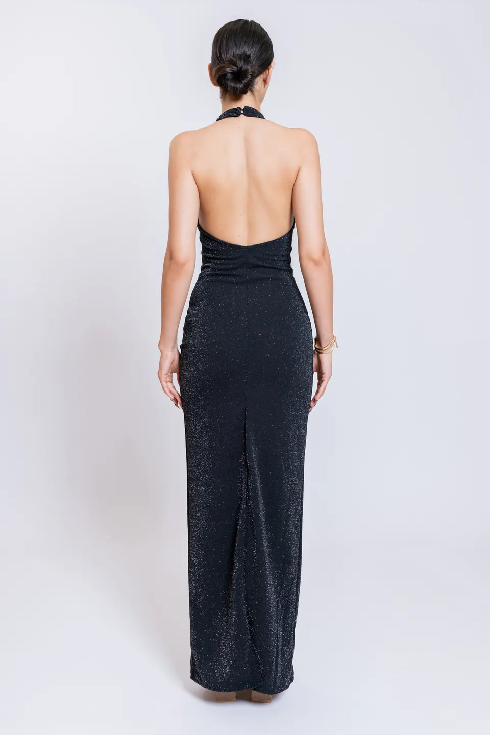 Back view of the CÉLINE black maxi dress with open back and rear slit