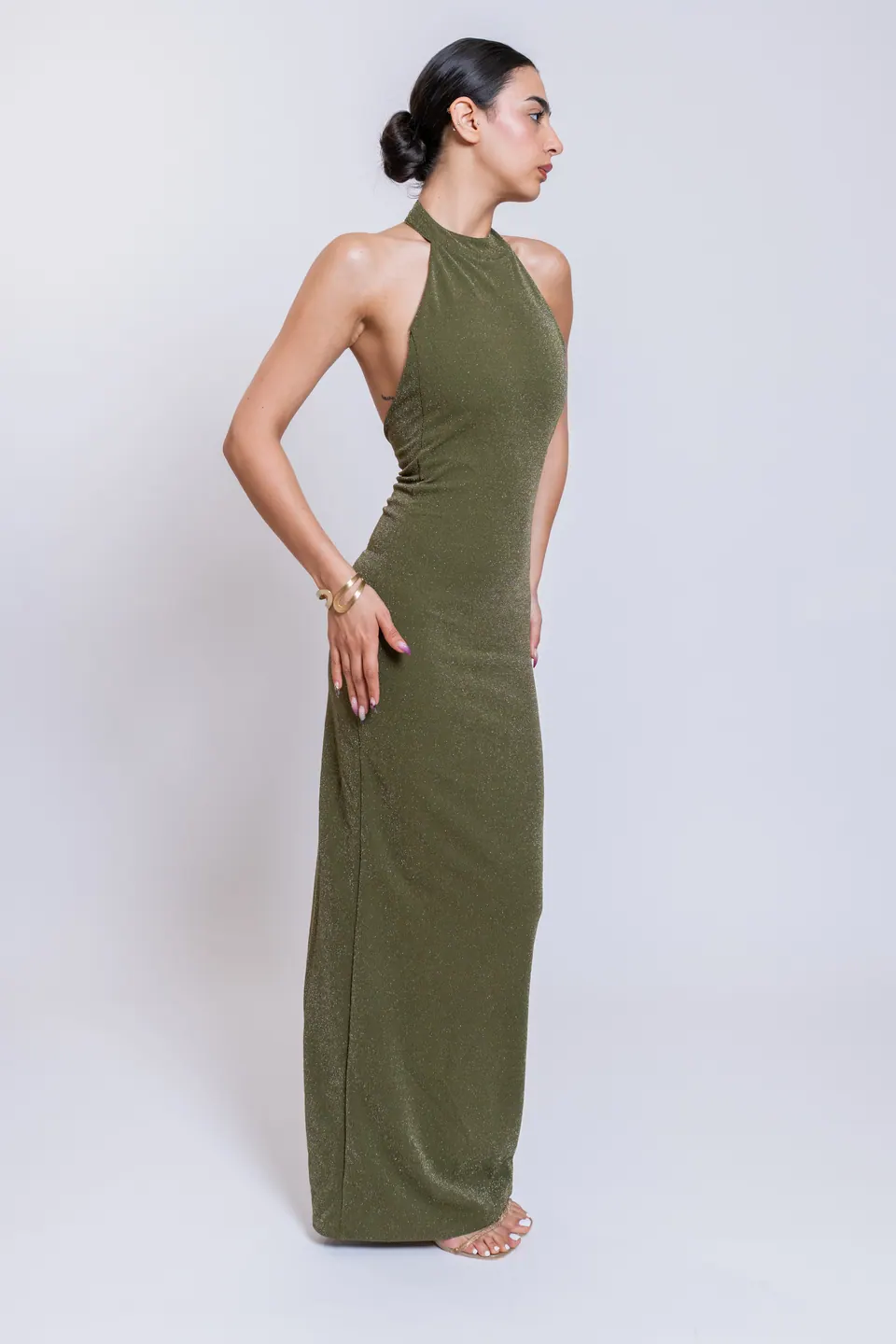 CÉLINE olive green high halter maxi dress in three-quarter side view
