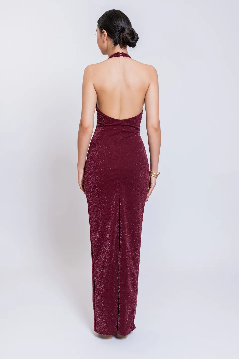 Back view of the CÉLINE burgundy maxi dress with open back and rear slit